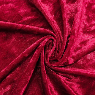 Shiny red velvet fabric swirl texture close-up#whtbkgd