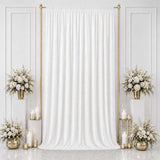 Elegant white wedding backdrop with gold accents and floral arrangements