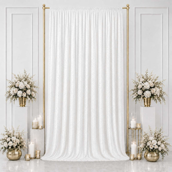 Elegant white wedding backdrop with gold accents and floral arrangements