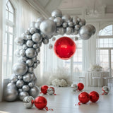 Decorative balloon arch with red and silver balloons in a festive setting.