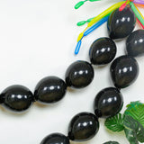 Black balloons in a festive arrangement on a white background.