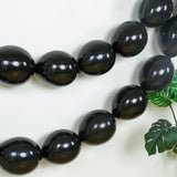 Black balloons garland decor for parties and celebrations.