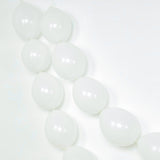 White balloons arranged in a decorative garland on a white background.