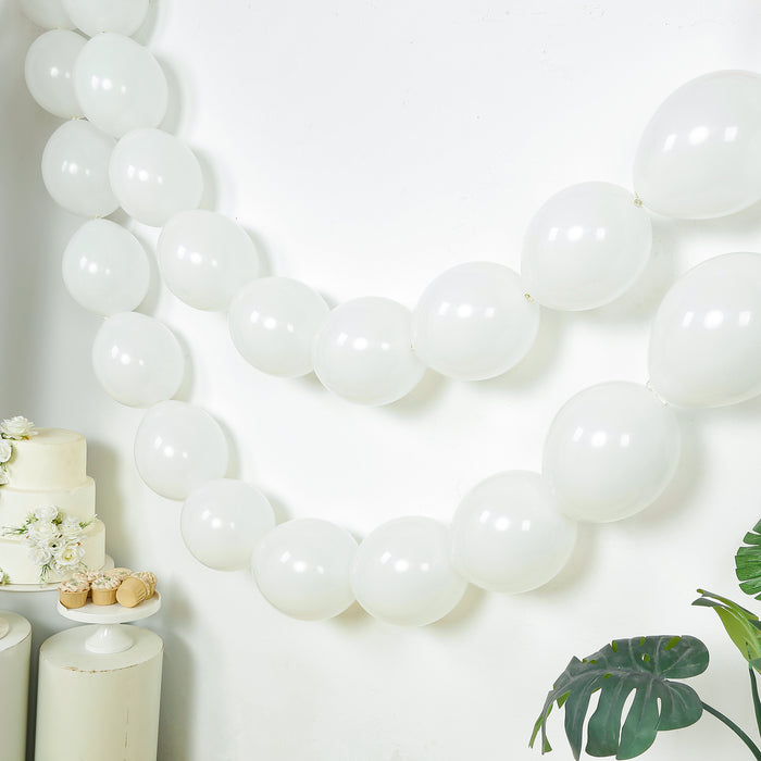 White balloons strung together for party decoration