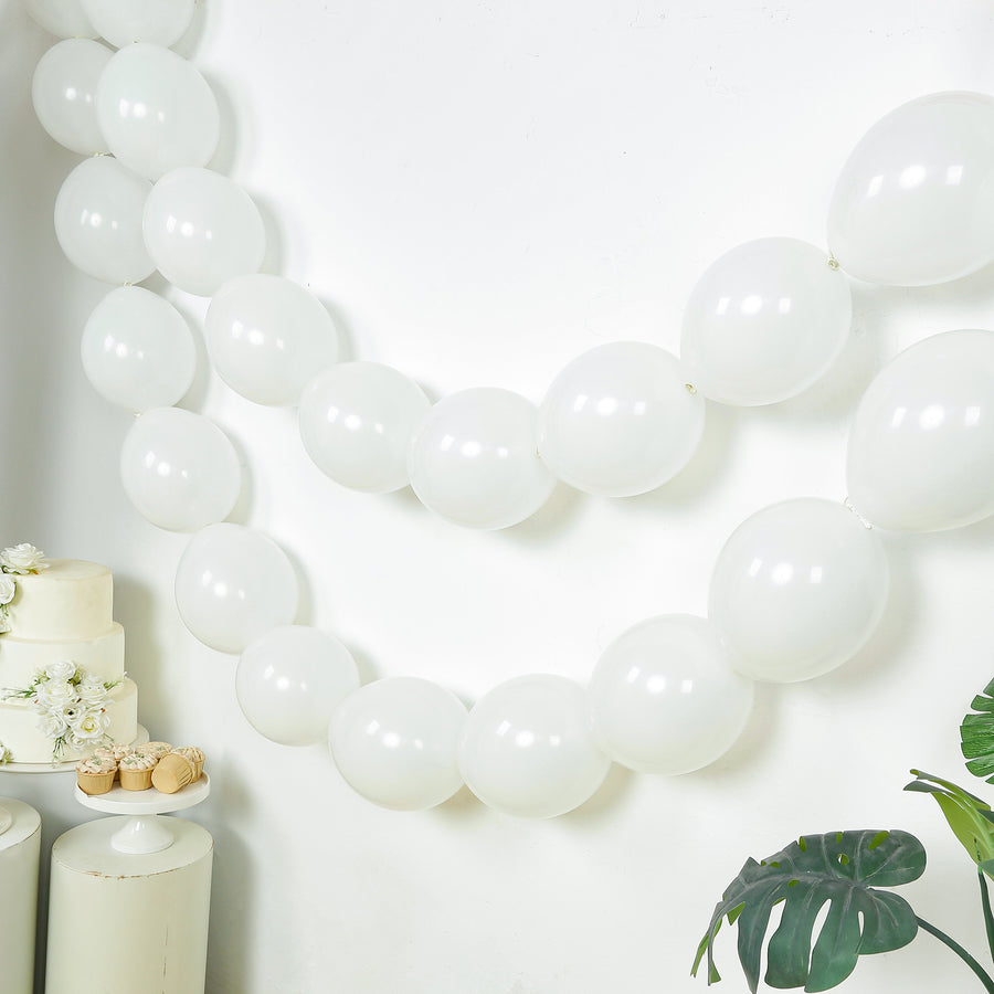 White balloons strung together for party decoration