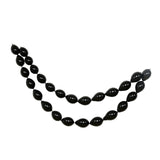 Black decorative bead garland on a plain white background #whtbkgd