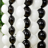 Black and white balloons arranged in a decorative garland.