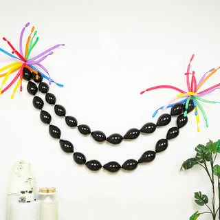 Colorful balloon garland decoration with black and vibrant accents