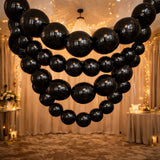 Black balloon chandelier decoration for elegant events and parties.