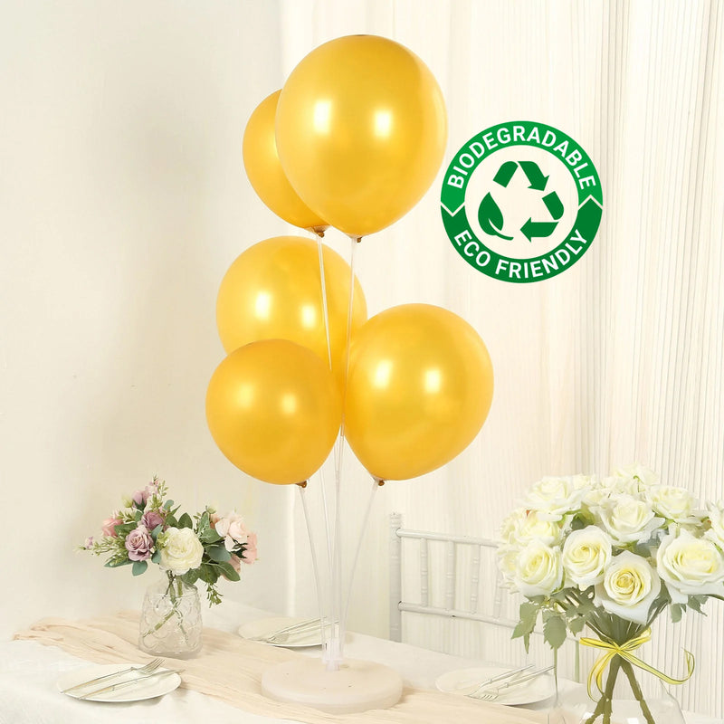 Gold biodegradable balloons at a decorated table setting