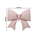 Pink bow-shaped pillow, 27x29 inches, studio-style isolation shot.