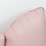 Pink inflatable pillow with a smooth surface and rounded edges