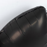 Black inflatable cushion with visible creases against a white background