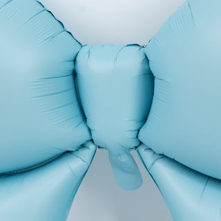 Light blue balloon bow on a plain background.