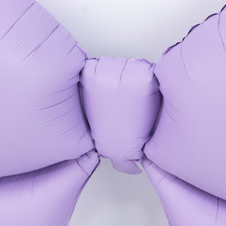 Purple balloon bow centerpiece for events and celebrations