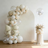 Elegant balloon arch with roses and decorative elements for events and celebrations.