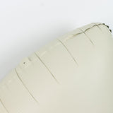 Beige inflatable pillow with textured surface