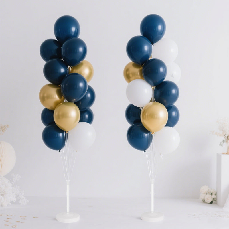 Two balloon columns in navy, gold, and white