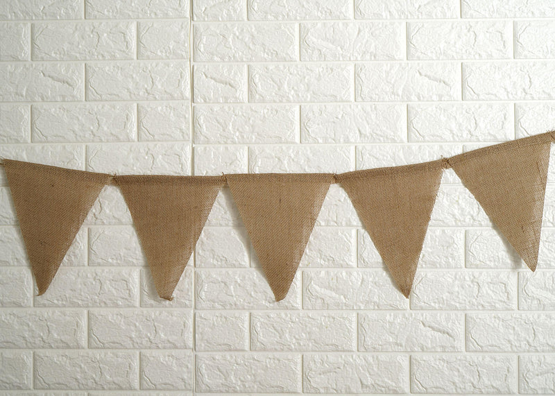 Wide shot of the picnic table setting with bunting backdrop
