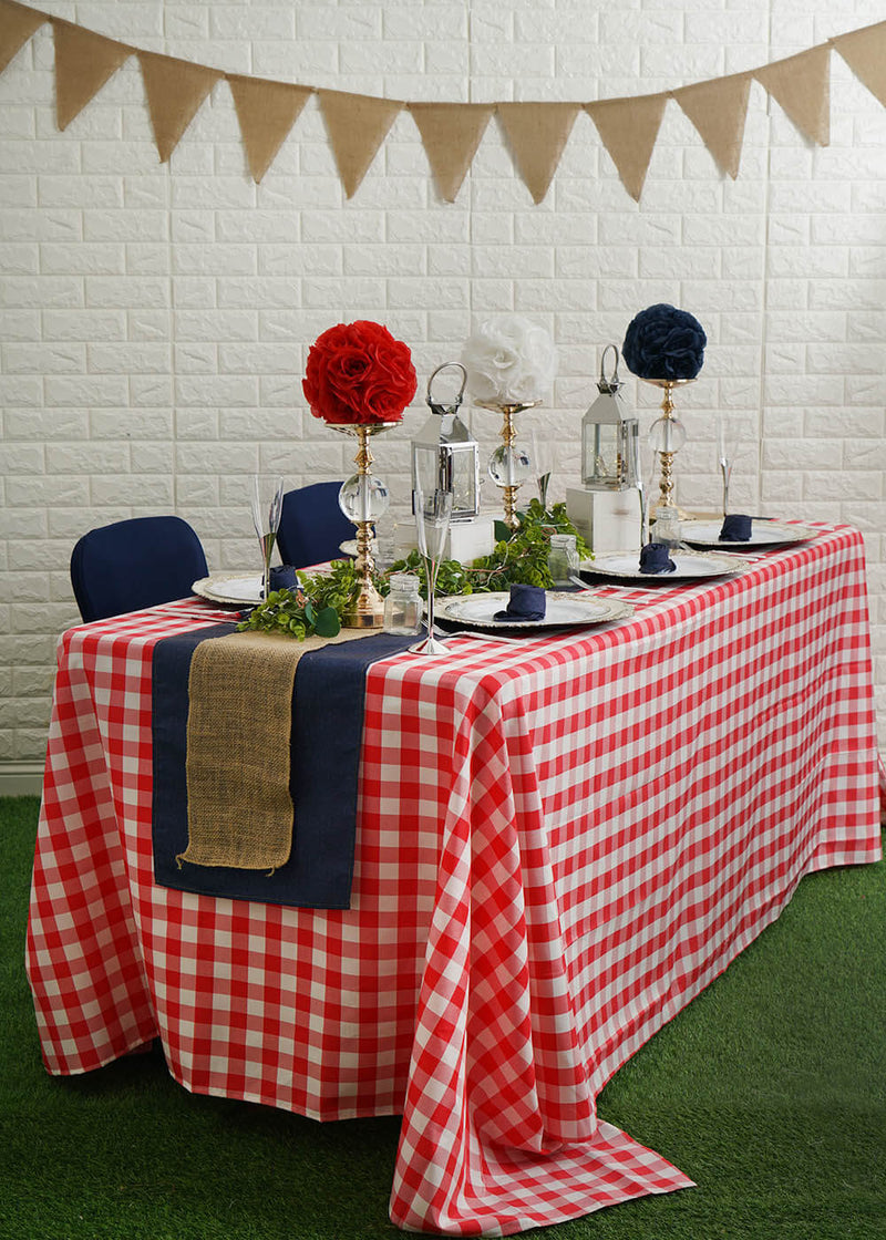 Burlap bunting against a white brick wall
