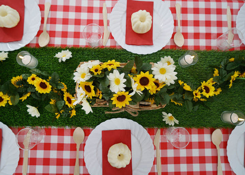 Overhead view of a floral table centerpiece on a checkered table