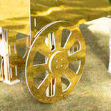 Gold decorative cart wheel on grass