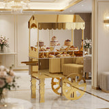 Gold dessert cart with sweets in an elegant interior setting.