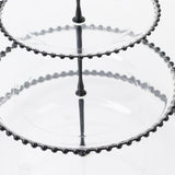 Two-tiered glass serving stand with decorative bead detail.