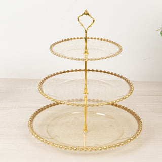 <h3 style="margin-left:0px;"><strong>Clear Gold Glittered 3-Tier Round Plastic Cupcake Tower Stand with Beaded Rim</strong>