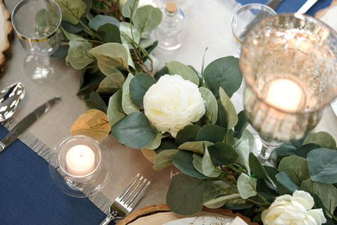 Clear glass candle holder with lit candle