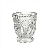 Decorative clear glass candle holder with ornate embossed design#whtbkgd