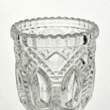 Clear textured glass candle holder with decorative etched pattern