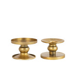 Set of two elegant gold candle holders on a white background. #whtbkgd