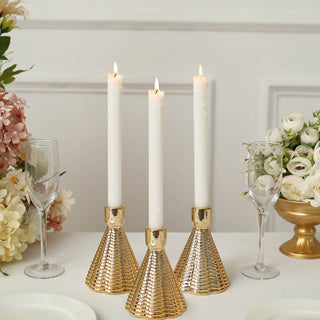 Introduce Style and Functionality with Metallic Gold Cone Shaped Candle Holders