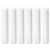 Set of six white pillar candles on a plain white background #whtbkgd