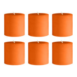 Set of six vibrant orange pillar candles on a white background #whtbkgd