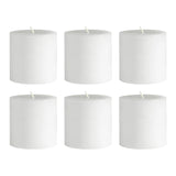 Set of six white pillar candles on a plain background #whtbkgd