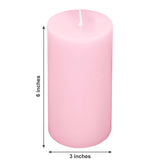 Pink pillar candle, 6 inches tall and 3 inches wide.
