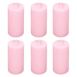 Set of six pink pillar candles on a white background. #whtbkgd