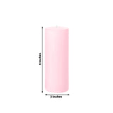 Pink pillar candle, 9 inches tall and 3 inches wide.