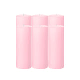 Set of four pink pillar candles in a studio-style isolation shot. #whtbkgd