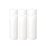 Four white pillar candles arranged together on a plain background. #whtbkgd