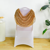 Gold sequin shawl draped over a white chair.