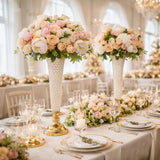 Elegant floral centerpieces with roses in a luxurious wedding setting.