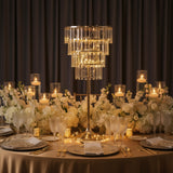 Elegant chandelier centerpiece on a beautifully set dining table with floral arrangements.