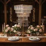 Elegant table setting with a crystal chandelier lamp and floral arrangements.