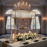 Elegant dining table centerpiece with candles and flowers in a luxurious setting.