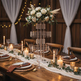 Elegant table setting with floral centerpiece, candles, and decorative elements.
