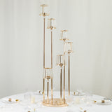 Elegant gold candle holder with multiple glass shades on a dining table.