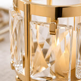 Gold crystal chandelier close-up with faceted glass and modern luxury design